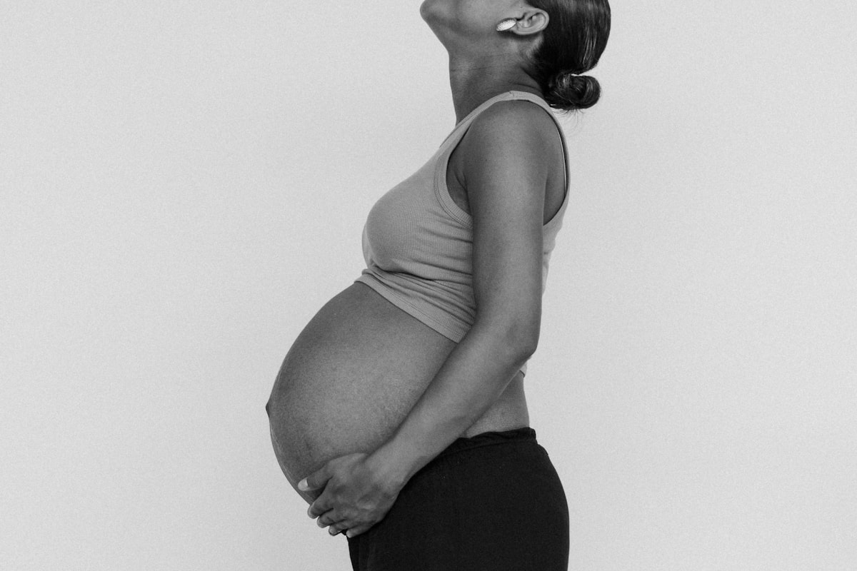 Black pregnant woman practising safe prenatal movement