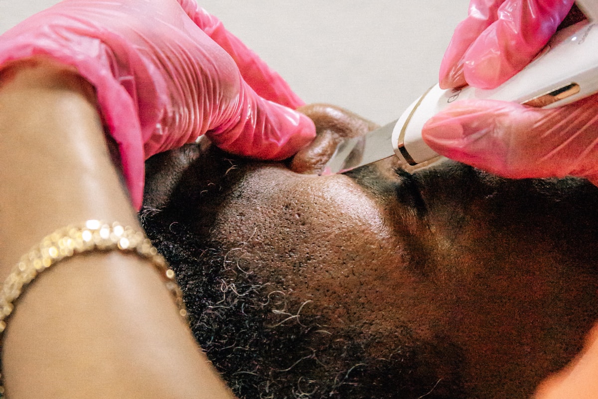 Black man receiving a professional barber and grooming service
