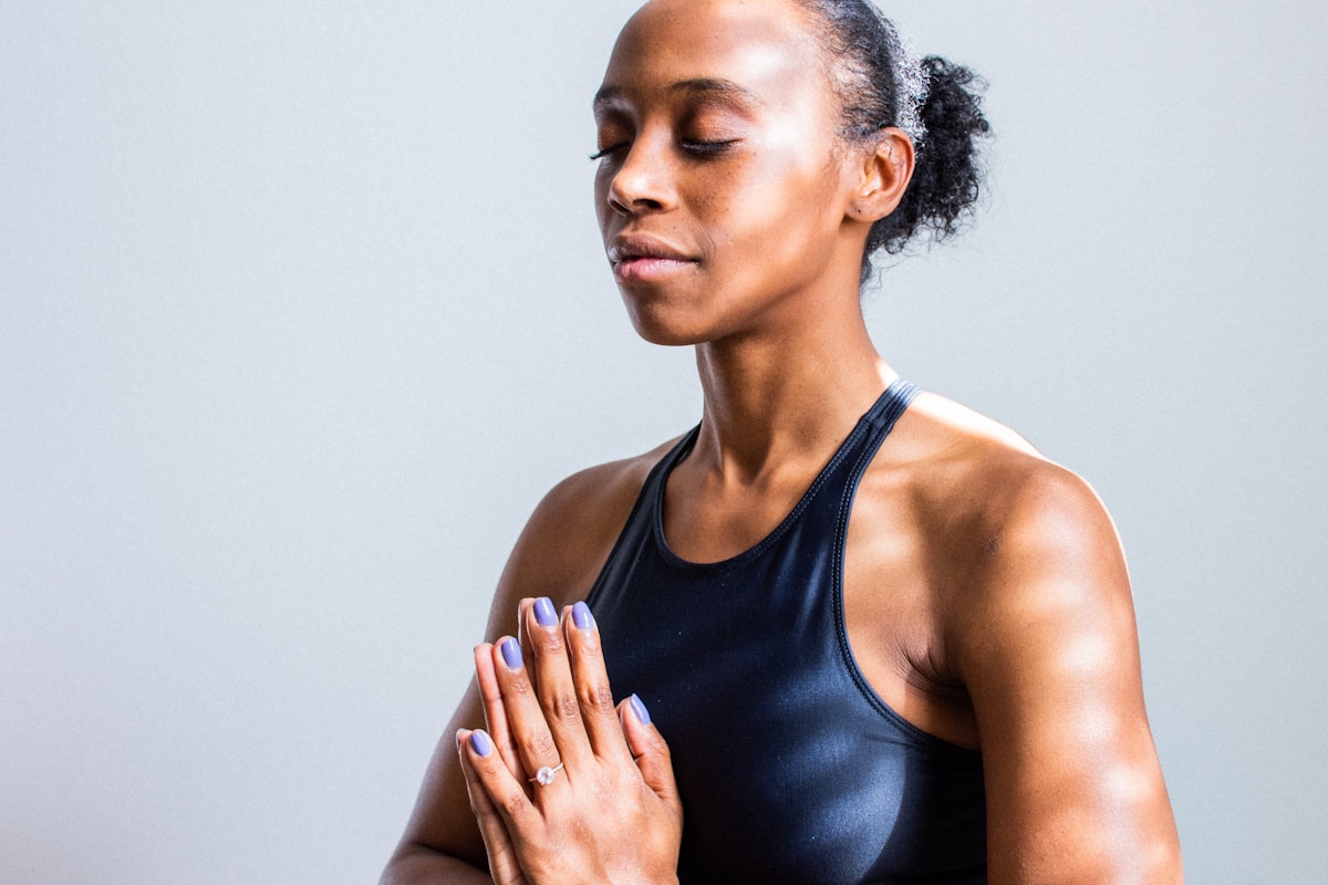 Black woman practising mindful yoga and breathwork